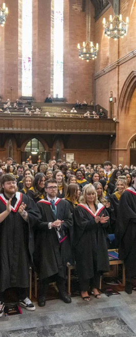 Graduates standing and applauding inside a grand church during the Glasgow Kelvin College graduation ceremony. Graduates standing and applauding inside a grand church during the Glasgow Kelvin College graduation ceremony.